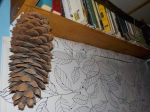 Moldy sugar pine cone hanging from my bookshelf.
